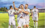  ?? MIKE SANDOVAL/FOR THE JOURNAL ?? New Mexico United’s Nicky Hernandez (8) is hugged by his teammate Josh Suggs (5) as he celebrates scoring a goal Saturday night against Sacramento Republic FC.