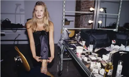  ?? Photograph: Catherine McGann/Getty Images ?? Kate Moss getting ready for a fashion shoot in New York in 1995.