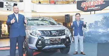  ??  ?? Tomoyuki (right) and Mitsubishi Malaysia chief operating officer Ilham Helmi are seenat the launch of the enhanced Mitsubishi Triton. Mitsubishi Motors Malaysia Sdn Bhd aims to expand its market share in the local pick-up truck segment to 15 per cent with the launch of its enhanced Triton model.