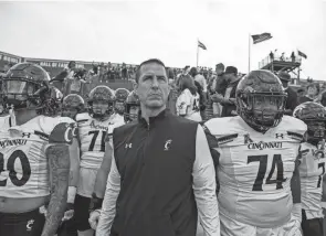 ?? CARA OWSLEY/THE ENQUIRER ?? Former Desales wrestling and football star Luke Fickell has his Cincinnati Bearcats in the College Football Playoff.