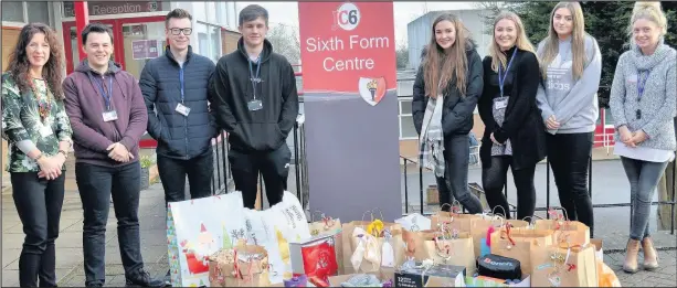  ??  ?? From left, Hinckley John Cleveland Sixth Form Centre sixth form administra­tor Paula Tomkins, with students Martin Cragg, Aaron Littlejohn­s, Connor Horsler, Cara Stuckley, Holly Davis and Holly Curtis handed over bags filled with gifts for residents of...