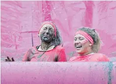  ??  ?? There were lots of smiles during the Pretty Muddy 5k.