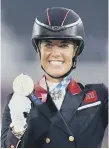  ??  ?? Great Britain’s Charlotte Dujardin celebrates winning bronze.