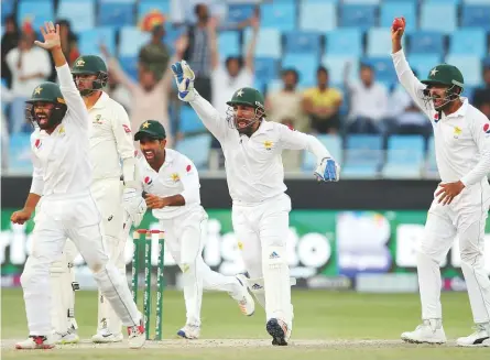  ?? AP ?? Pakistan players appeal for the dismissal of Australia’s Nathan Lyon during the first Test in Dubai, With the Aussies having clinched a draw in the first Test, the pressure is on Pakistan in the second Test starting today.