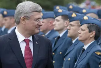  ?? ADRIAN WYLD/THE CANADIAN PRESS ?? Prime Minister Stephen Harper reviews the troops during ceremonies marking Canadian Forces Day in North Bay, Ont., last week. Harper must soon find a new chief of defence staff.