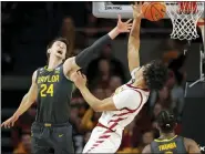  ?? MATTHEW PUTNEY — THE ASSOCIATED PRESS ?? Baylor guard Matthew Mayer (24) pokes the ball away from Iowa State forward Robert Jones (12) during the second half of an NCAA college basketball game on Saturday in Ames. Baylor won 77-72.