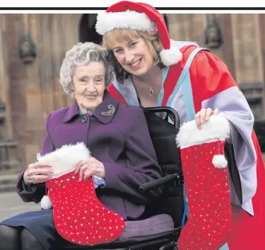  ??  ?? Queen’s student Freda McCormick, from Dundonald, graduates tomorrow with a Doctorate of Education from Queen’s. Committed to caring for older relatives, including her 92-year-old mother-in-law Mary, Freda decided to put her personal experience into...