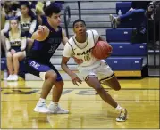  ?? OWEN MCCUE - MEDIANEWS GROUP ?? Spring-Ford’S EJ Campbell (0) looks toward the hoop as Central Bucks South’s Flynn Carroll (30) defends on Saturday.