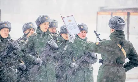  ?? ?? Servicemen take a military oath in January in the Voronezh region of Russia.
RUSSIAN DEFENSE MINISTRY PRESS SERVICE