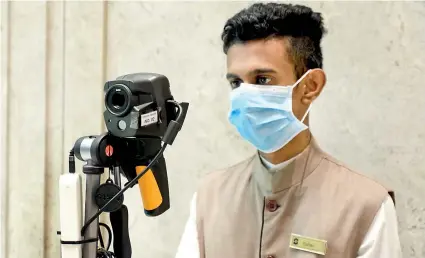  ??  ?? Temperatur­e testing equipment at the entrance to the Shangri-La Hotel, Colombo where visitors are checked round-the-clock, as a precaution against COVID-19. Pic by Amila Gamage