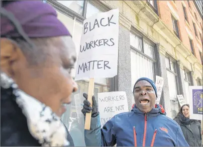  ?? THE CANADIAN PRESS/ANDREW VAUGHAN ?? Protesters gather outside the Founders Square building in Halifax on Monday. Seven black janitorial workers, set to lose their jobs at the end of the month when their cleaning contract ends and a new contractor takes over, were fired after indicating...