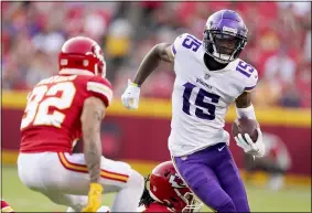  ?? CHARLIE RIEDEL — THE ASSOCIATED PRESS ?? Vikings wide receiver Ihmir Smith-Marsette runs with the ball as Chiefs safety Tyrann Mathieu defends during an Aug. 27 preseason game.