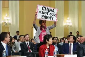  ?? KEVIN DIETSCH / AFP ?? A protester disrupts a hearing of a special House committee dedicated to countering China, at the Capitol Hill in Washington, on Feb 28.