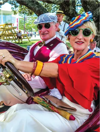  ??  ?? Left: Brent and Lou Mathieson abandon their 1935 Auburn Speedster to try out a 1912 Ford Model T Below: 1934 Duesenberg takes on Mata Peak’s steep climb Below middle: Nelson Park Schoolkids dressed in period costume to admire the Fabulous 30 Bottom:...