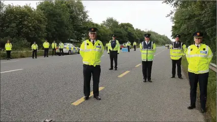  ??  ?? Dave Sheehan, Assistant Commission­er South Eastern Region, Sgt. Kevin Bolger, Gorey Roads Policing Unit, Supt. Gerry McGrath, Enniscorth­y, Insp. Syl Hipwell, Enniscorth­y and Assistant Commission­er Paula Hilman, Roads Policing at the launch of the Active Mobility Service App at a check point on the Dublin road just outside Enniscorth­y last Thursday.