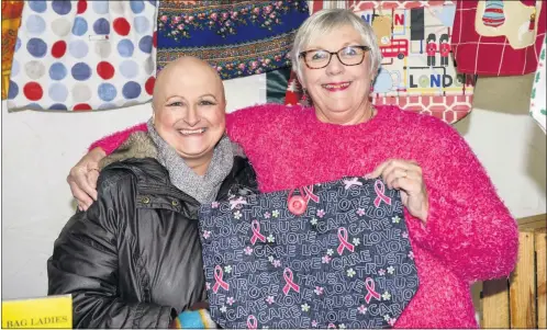  ??  ?? Janet Plimley and Gail Bradbury with the bag which is to be filled for auction.