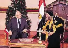  ??  ?? Reaching out Pope Tawadros II of Alexandria with interim President Adly Mansour in Cairo on Sunday.
EPA