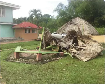  ??  ?? Remnants of a benab that was destroyed by the storm at Splashmins Fun Park