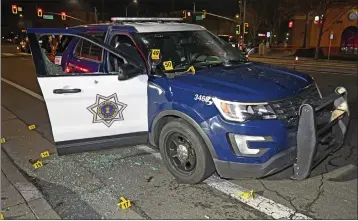  ?? SAN JOSE POLICE ?? An evidence photo San Jose police released Tuesday shows a patrol vehicle with bullet holes after authoritie­s say Luis Alberto Cantu, 37, of San Jose opened fire on officers during a traffic stop the night of Feb. 3.