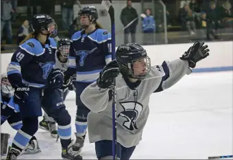  ?? STUART CAHILL — BOSTON HERALD ?? St. Mary’s Tia Picardi celebrates her goal during a 2-0 girls hockey win over Peabody in state tournament action Wednesday in Lynn.