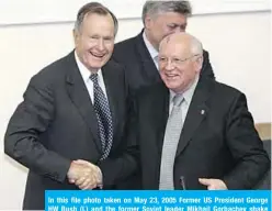  ??  ?? In this file photo taken on May 23, 2005 Former US President George HW Bush (L) and the former Soviet leader Mikhail Gorbachev shake hands after a speech at the State Foreign Affairs University in Moscow.