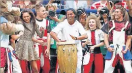  ??  ?? ■ Former Brazil footballer Ronaldinho with performers during the closing ceremony in Moscow.REUTERS