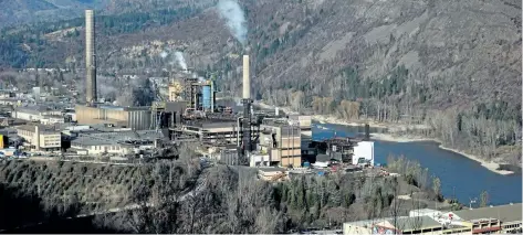  ?? CANADIAN PRESS FILES ?? Teck Resources’s zinc and lead smelting and refining complex, left, is pictured in Trail, B.C. The company made a small profit in the second quarter, but is hopeful that better days are ahead as commodity prices continue to recover.