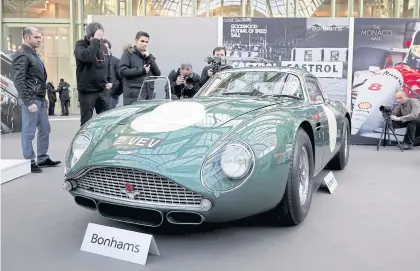  ?? REUTERS ?? Classic Aston Martin The 1961 Aston Martin DB4 GT Zagato (2 VEV) is on display ahead of Bonhams’ Les Grandes Marques du Monde vintage car and motorcycle auction at the Grand Palais exhibition hall as part of Salon Retromobil­e 2018 in Paris yesterday.