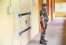  ?? E. LAKSHMI NARAYANAN ?? Central Armed Police Force personnel guarding the strong room where the EVMs and VVPATs used in the Lok Sabha polls to Salem constituen­cy have been stored.