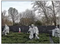  ?? The Washington Post/RICKY CARIOTI ?? The steel statues of The Korean War Veterans Memorial make a dramatic image, especially for evening visitors.