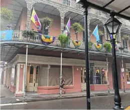  ??  ?? A balcony decorated for Mardi Gras in New Orleans’ French Quarter.