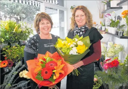  ?? PHOTO: ?? Rhonda Claypole (left) new owner of The Village Florist with assistant Monique Bottomley.