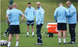  ?? Photograph: Adam Vaughan/EPA ?? Pep Guardiola in Manchester for a training session on Tuesday, from which Kyle Walker was absent due to a ‘disturbanc­e in his back’.