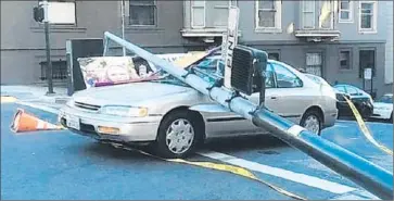  ?? KTVU-TV ?? CORROSION FROM human and dog urine is thought to have contribute­d to the collapse of a light pole that fell on a car in San Francisco. Officials have added solar-powered portable toilets to help alleviate the problem.