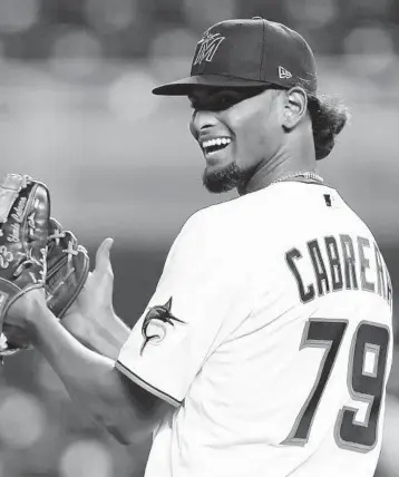  ?? MICHAEL REAVES/GETTY ?? Marlins pitcher Edward Cabrera reacts to a double play during the sixth inning against the Nationals at loanDepot park on Wednesday night.