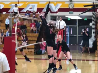  ?? Diego Marquez/The Signal (See additional photos on signalscv.com) ?? Hart volleyball’s Zoe DiNardo jumps up for a block in a game against La Cañada at La Cañada on Thursday. The Indians won 3-2.