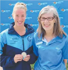  ??  ?? HONOURED: Madison Cooper receiving her Australia Day award from Swimming Victoria’s technical director Heather O’Connor.