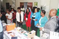  ?? — Picture: Nicholas Bakili ?? Minister of Informatio­n Communicat­ion Technology, Postal and Courier Services, Dr Tatenda Mavetera (centre) speaks to the Permanent Secretary in her ministry Dr Beaullah Chirume (second from right) while her deputy Dingumuzi Phuti ( left) looks on during a tour of the Women Informatio­n Communicat­ion Technology (ICT) conference in Harare yesterday.