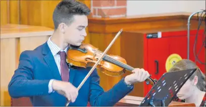  ??  ?? Xavier Gregory on violin was impressive and expressive at the Lyric Singers’ concert.