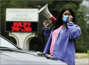  ?? JAY REEVES — THE ASSOCIATED PRESS ?? Health care worker Tonya Wilkes works at a Lowndes County coronaviru­s testing site in Alabama.