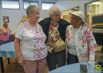  ?? Steve Mellon/Post-Gazette ?? Three ladies get together once again at the newly reopened Sheraden Healthy Active Living Center on Monday. From the left are Margaret Weber, 79, of Coraopolis; Emma Dimoff, 86, of Crafton Heights; and Viney Walker, 79, of Sheraden.