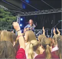  ??  ?? Rosie Ebsworth, singer songwriter, has landed a recording contract; on stage at Invicta Grammar School’s celebratio­ns for its 75th anniversar­y