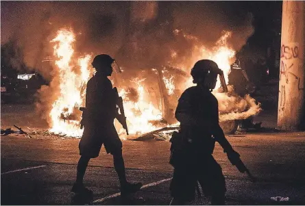  ??  ?? Fiery protests have erupted across the country after George Floyd’s death. RICARDO B. BRAZZIELL/( AUSTIN) AMERICAN- STATESMAN