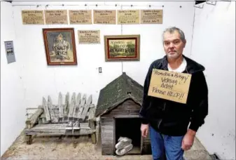  ?? PHOTOS BY ARNOLD GOLD — NEW HAVEN REGISTER ?? Artist Joe Fekieta amidst his “Homeless and Hungry 25Cent Project” at his home in New Haven.