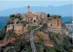  ??  ?? The town of Civita di Bagnoregio is known as the ‘‘dying town’’ - as the rock it’s perched on continues to fall away.