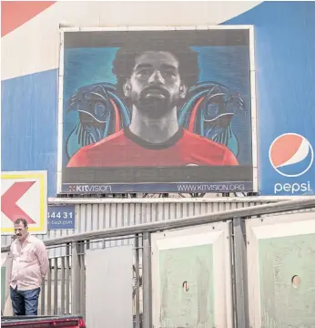  ??  ?? BelowMoham­ed Salah on a digital billboard for Pepsi.