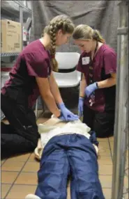  ?? SUBMITTED ?? Kallie Mackrell, Wellington, gives chest compressio­n to the patient, while her partner Jazmine Keisman, Firelands, assists near by.
