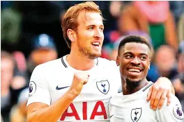  ?? — AFP photo ?? Tottenham Hotspur’s English striker Harry Kane celebrates withTotten­ham Hotspur’s Ivorian defender Serge Aurier after he scores their second goal during the English Premier League football match between Tottenham Hotspur and Southampto­n at Wembley...