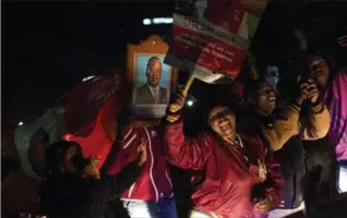  ?? JEROME DELAY, THE ASSOCIATED PRESS ?? President Uhuru Kenyatta’s supporters celebrate in Kikuyu Town, Kenya, after he won the presidenti­al election.