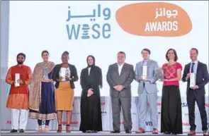  ?? PICTURES: ?? 2022 WISE Awards winners with HE the Minister of Education and Higher Education Buthaina bint Ali al-Jabr al-Nuaimi and WISE CEO Stavros N Yiannouka. Thajudheen